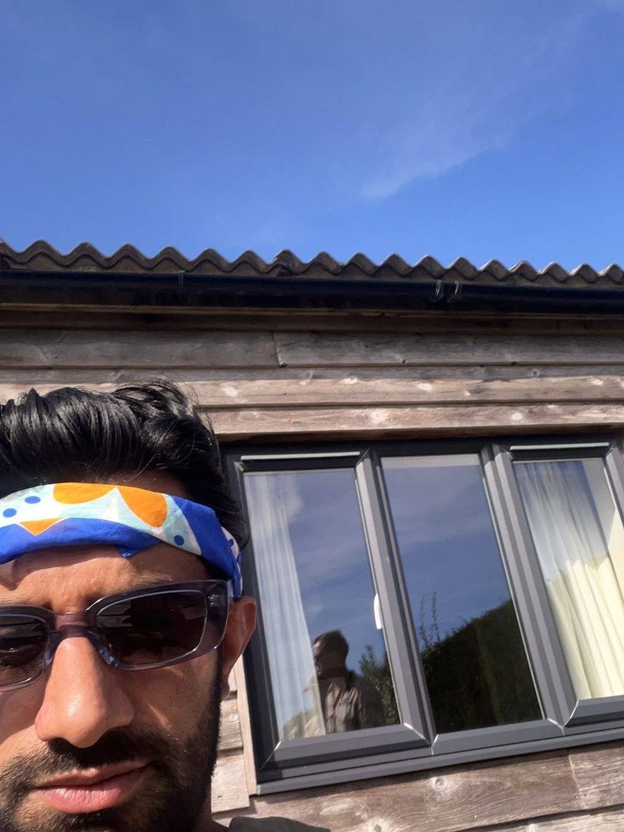 A guest wearing the scarf as a headband in the sun